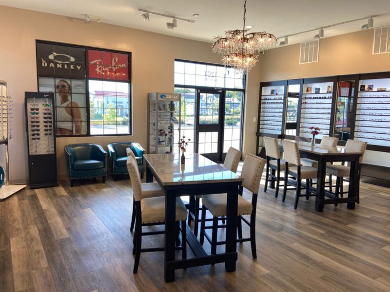 a lobby with chairs and tables and snack bar
