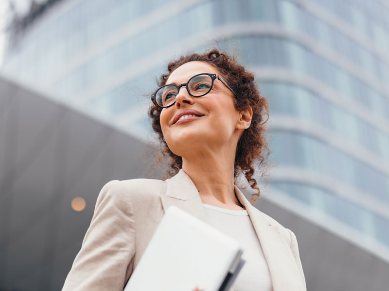 lady with glasses smiling