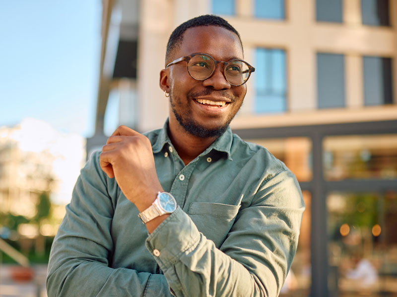 man with glasses smiling